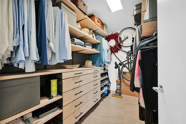 a bathroom with a double vanity sink toilet and mirror