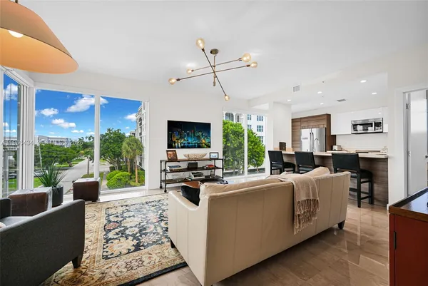 a room with furniture and wall paintings