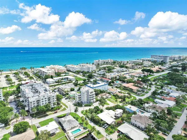 a view of a backyard with sitting area