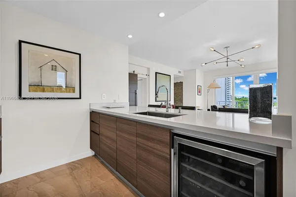 a kitchen with cabinets stainless steel appliances and cabinets