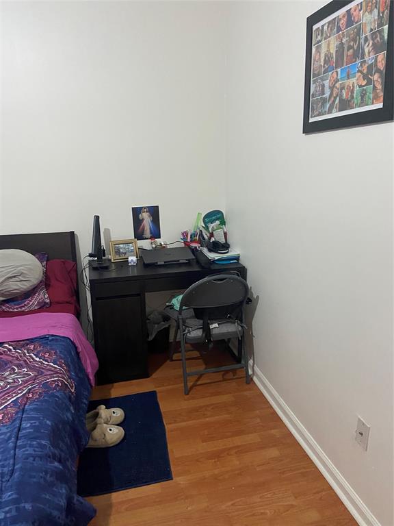 9641 Riverside Drive, Unit F1 Coral Springs, FL 33071 - Photo 5 of 18 a bedroom with a bed and a desk