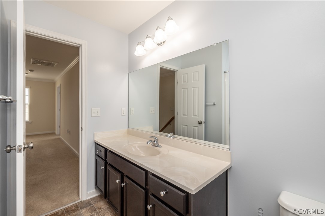 42 Waltons Store Road Louisa, VA 23093 - Photo 24 of 46 a bathroom with a sink vanity and a mirror