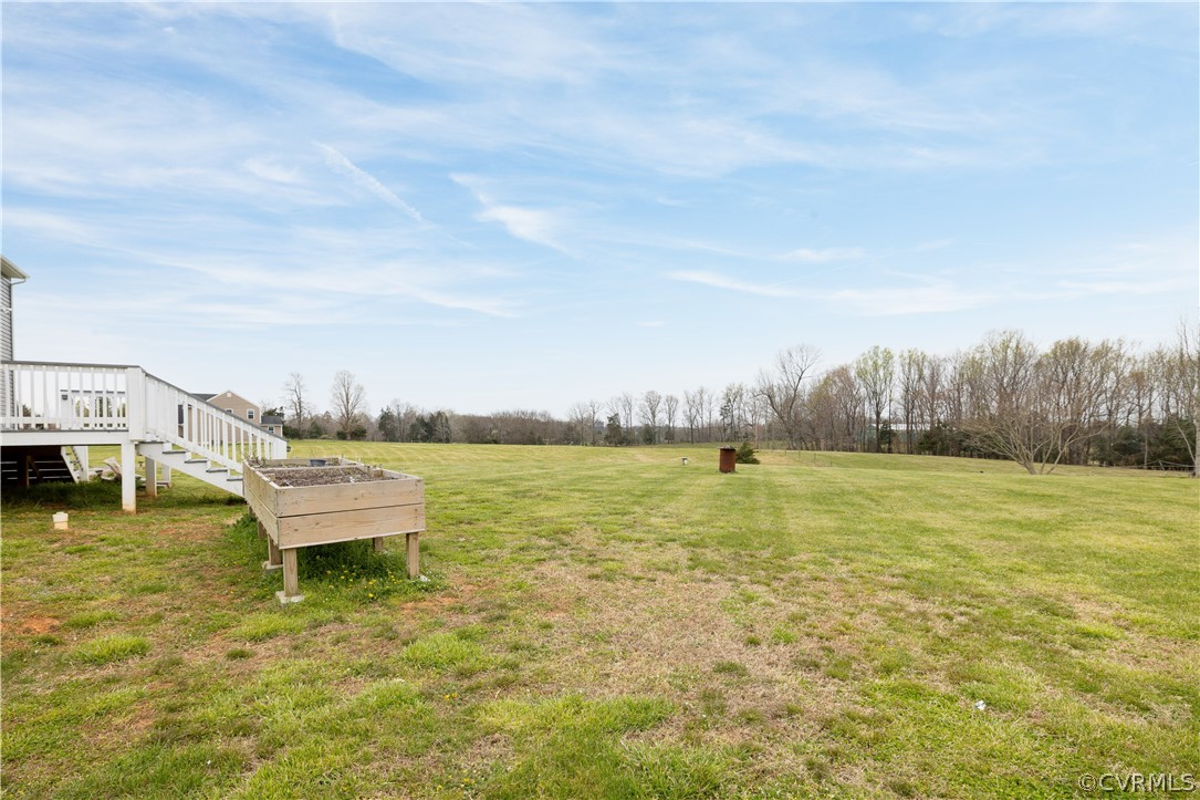 42 Waltons Store Road Louisa, VA 23093 - Photo 42 of 46 a view of a lake with houses in the back