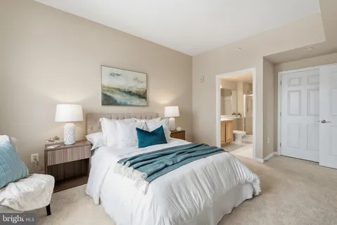 a bedroom with a bed and a couch