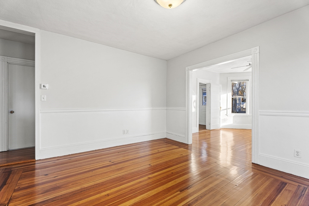 15 Sturgis Street Woburn, MA 01801 - Photo 13 of 38 wooden floor in an empty room