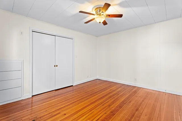 a view of a kitchen with fridge and workspace