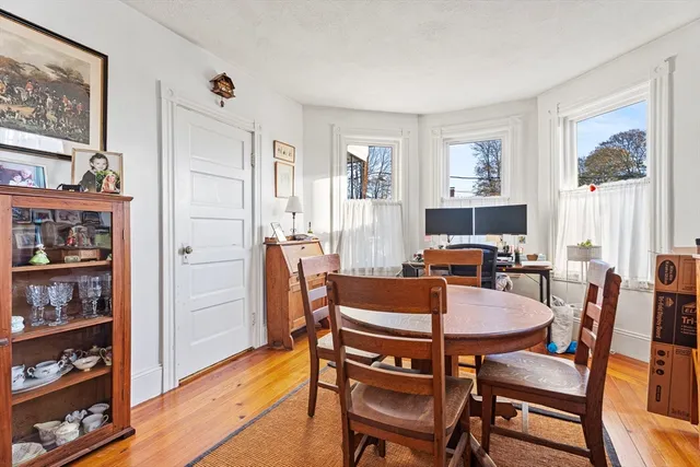 a bathroom with a sink mirror and toilet