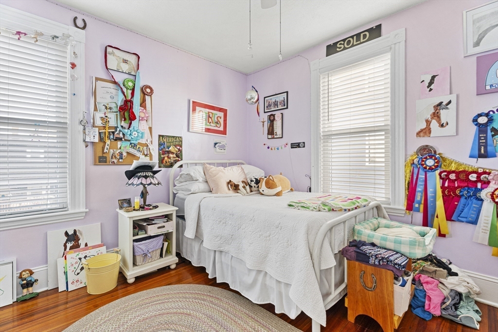 15 Sturgis Street Woburn, MA 01801 - Photo 25 of 38 a bed room with a bed and a couch