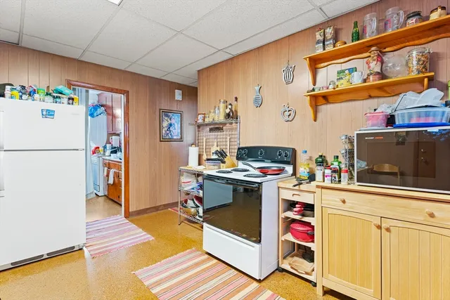 a living room with furniture a couch and a window