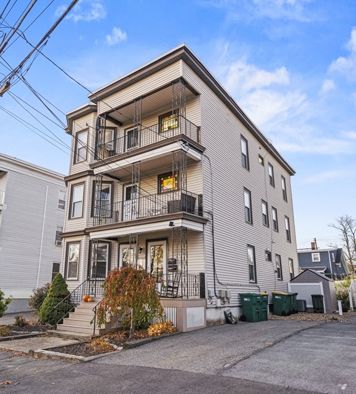 15 Sturgis Street Woburn, MA 01801 - Photo 3 of 38 a front view of a building