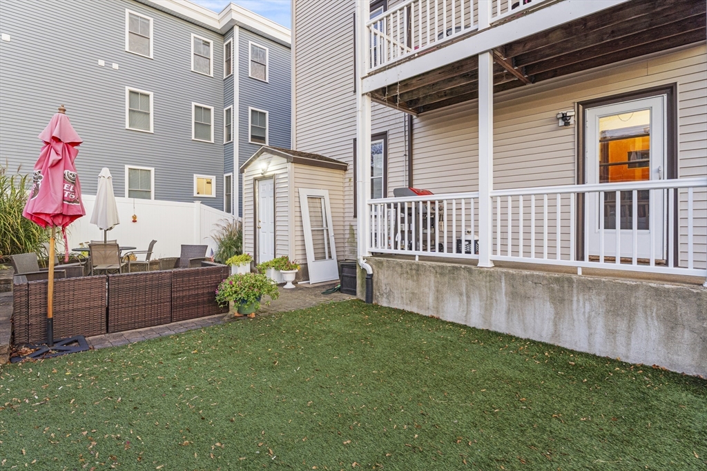 15 Sturgis Street Woburn, MA 01801 - Photo 35 of 38 a front view of a house with garden