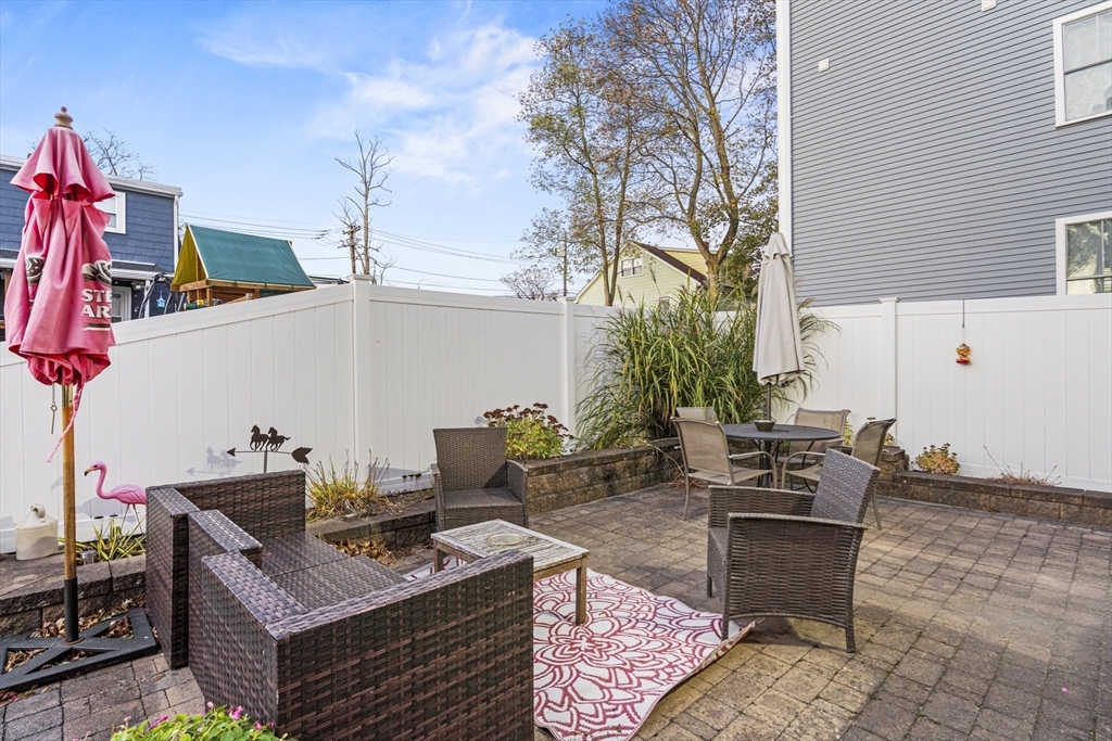 15 Sturgis Street Woburn, MA 01801 - Photo 36 of 38 a view of a terrace with furniture