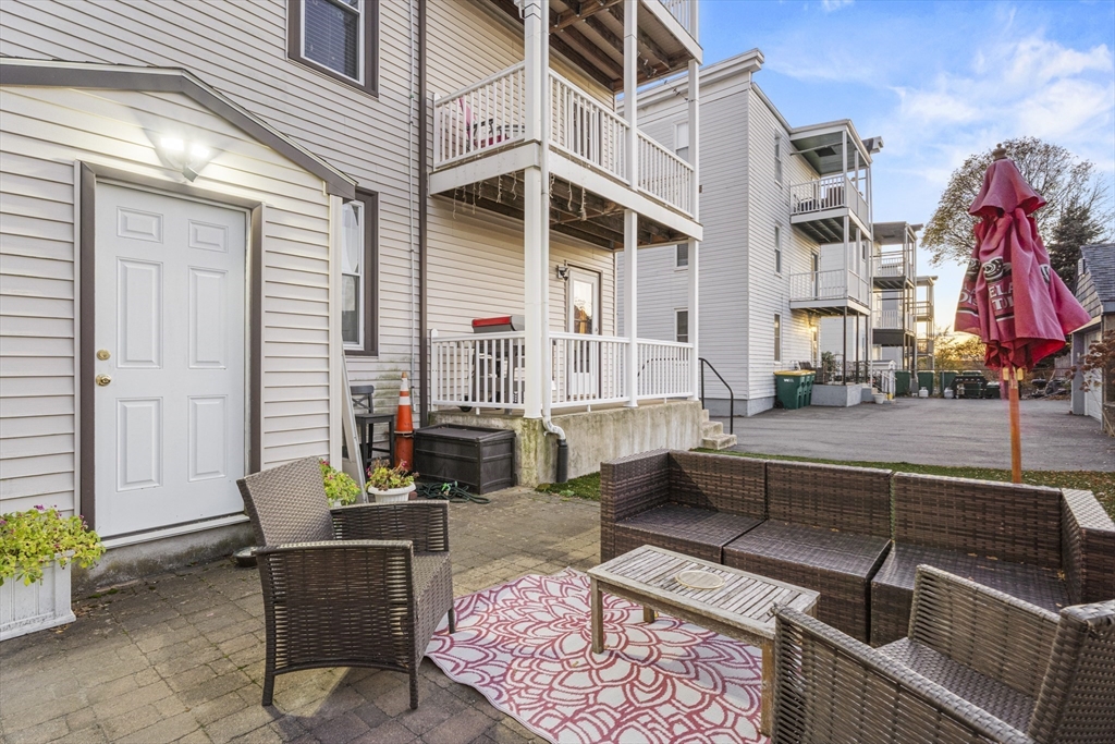 15 Sturgis Street Woburn, MA 01801 - Photo 37 of 38 a view of a building with sitting area