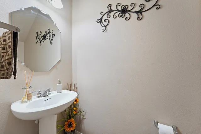 a bathroom with a sink and mirror