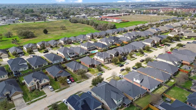 an aerial view of a city with lots of residential buildings