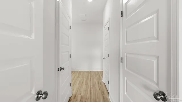 an empty room with closet area