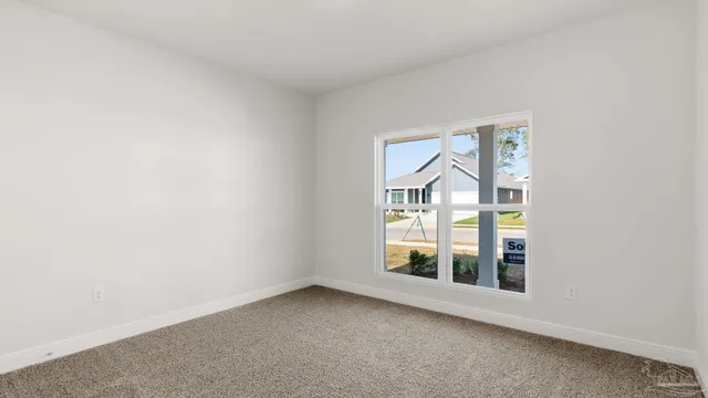 a kitchen with stainless steel appliances a sink stove top oven and white cabinets