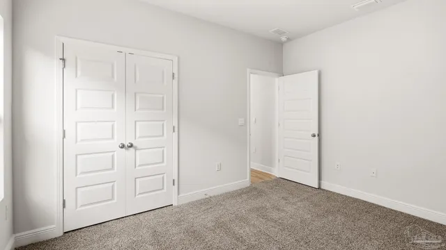 a view of a house with a swimming pool and a yard