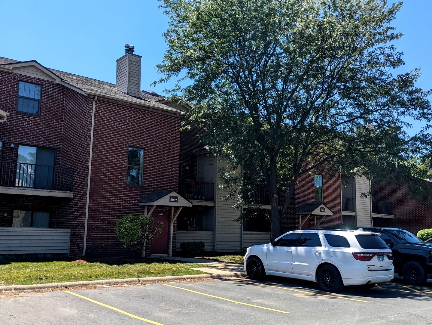 2032 North Rand Road, Unit 207 Palatine, IL 60074 - Photo 1 of 1 a car parked in front of a house