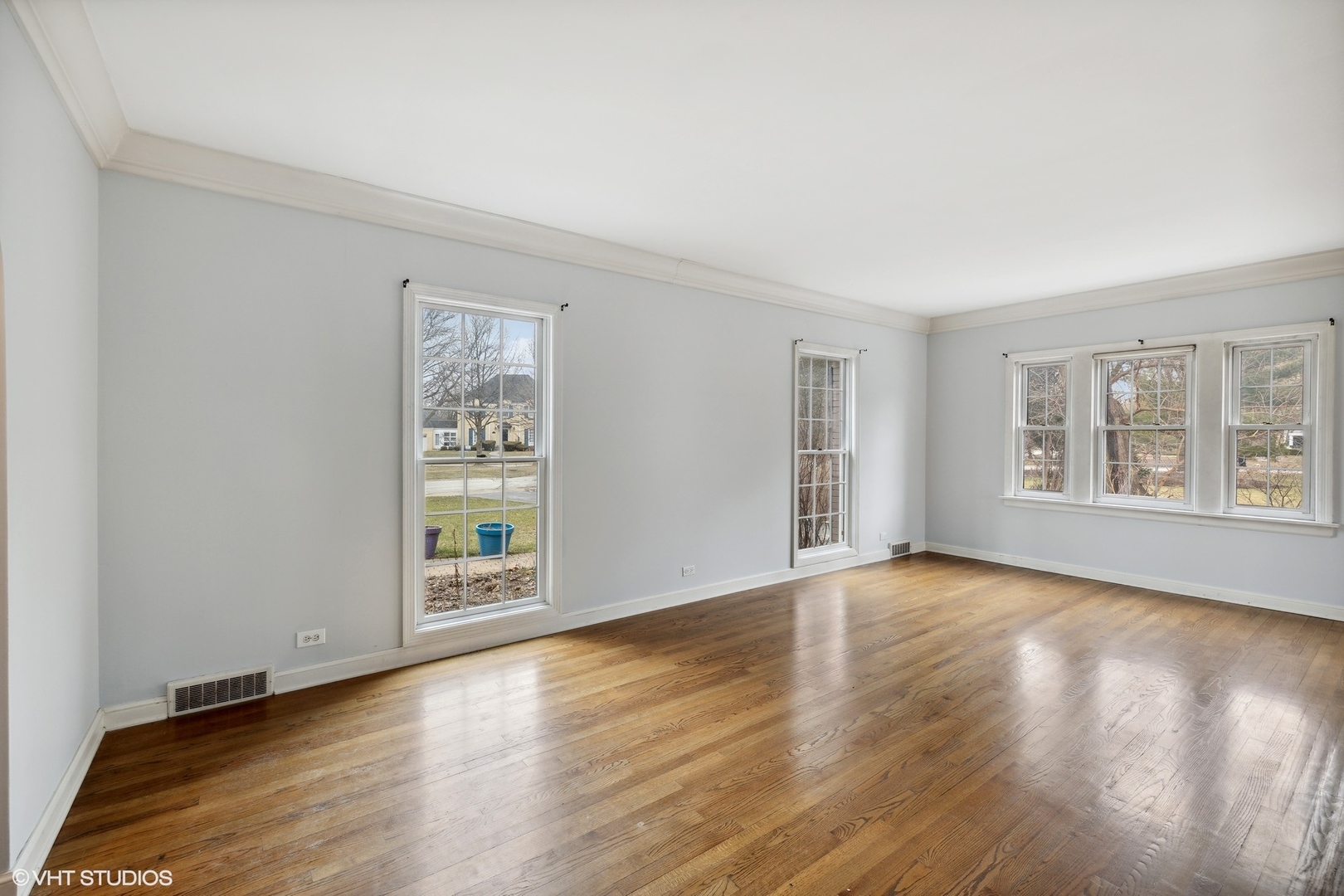 258 Nuttall Road Riverside, IL 60546 - Photo 5 of 32 a view of an empty room with window and wooden floor