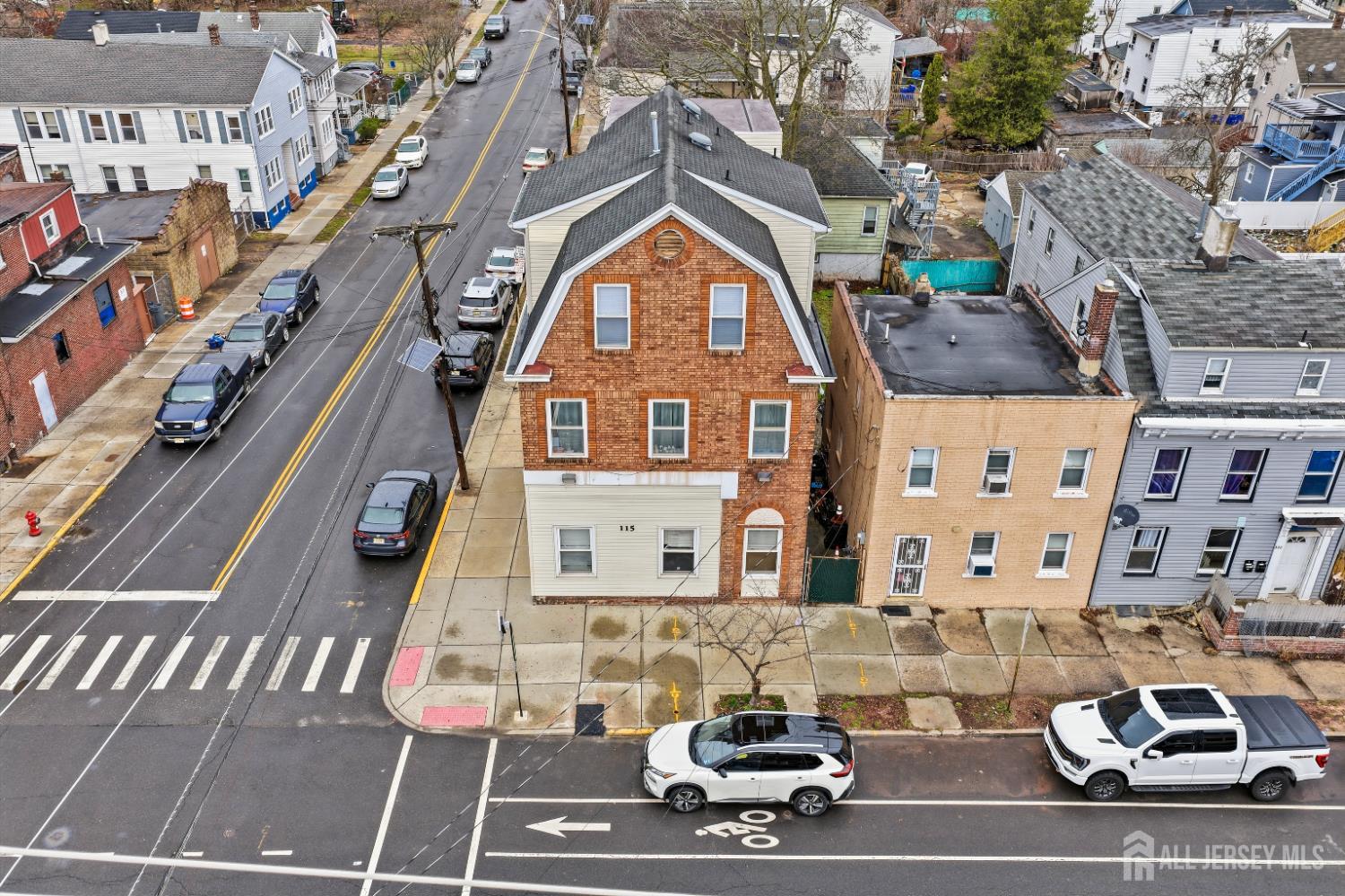 115 Remsen Avenue New Brunswick, NJ 08901 - Photo 16 of 38 a car parked on the side of a street