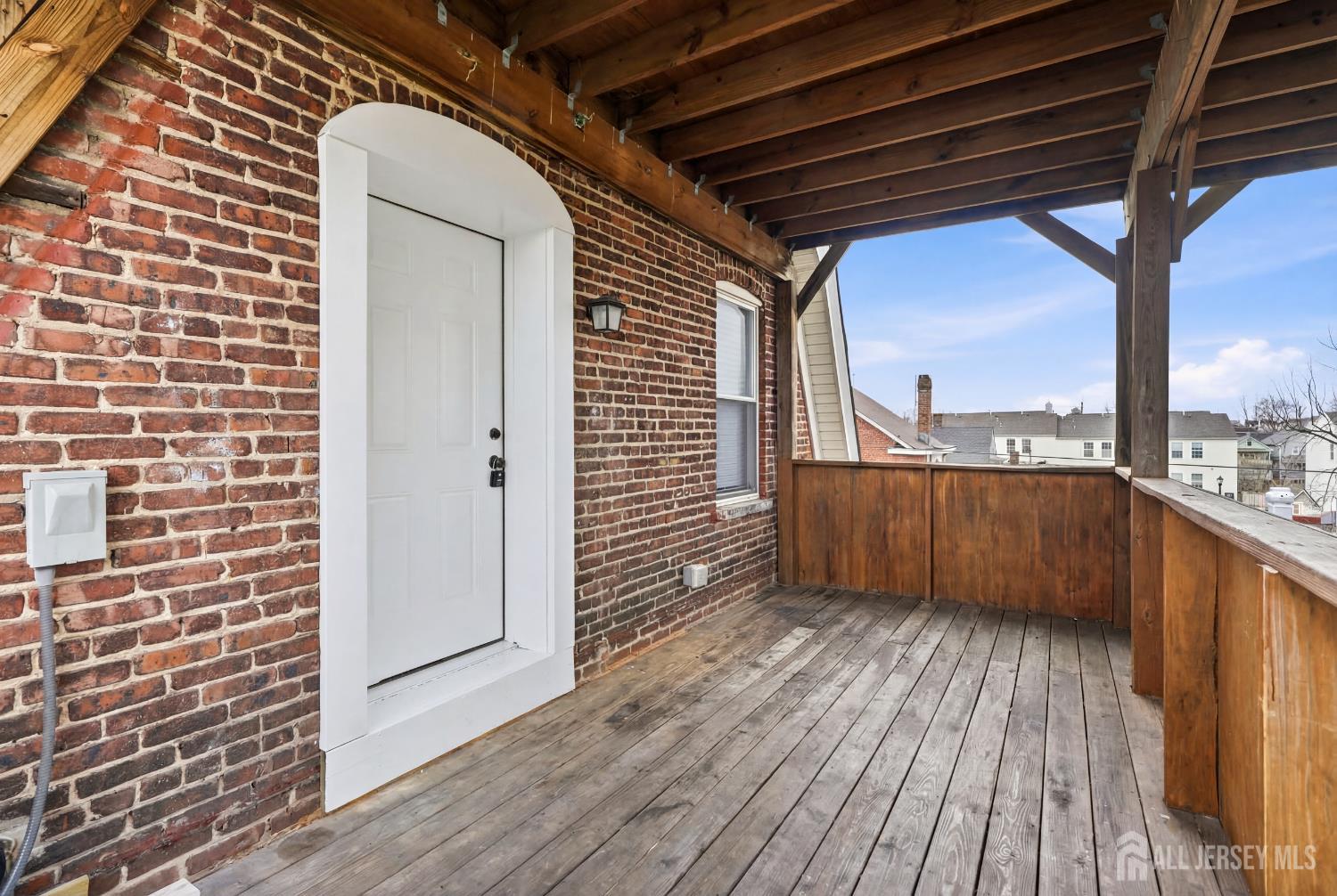 115 Remsen Avenue New Brunswick, NJ 08901 - Photo 20 of 38 a view of balcony with wooden floor