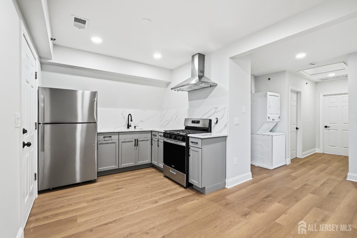 115 Remsen Avenue New Brunswick, NJ 08901 - Photo 26 of 38 a kitchen with a refrigerator and a sink