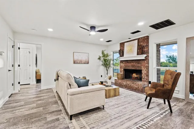a living room with furniture and a fireplace
