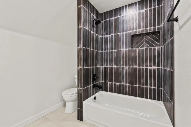 a bathroom with a bathtub and shower