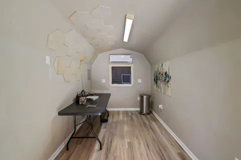 a room with furniture and wooden floor