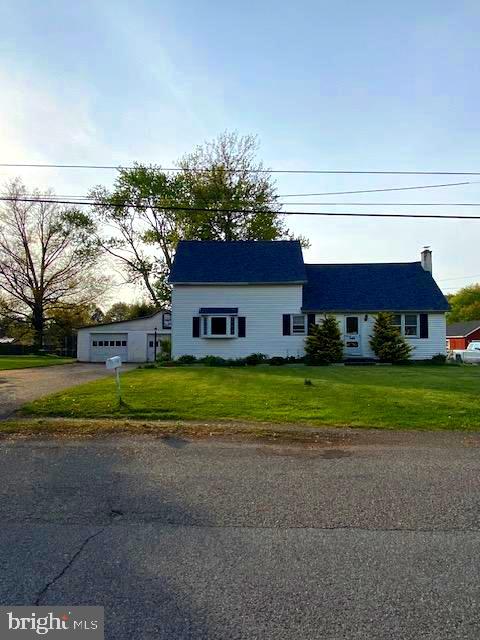1497 Hilltop Road Pottstown, PA 19464 - Photo 1 of 25 a front view of house with yard and trees in the background