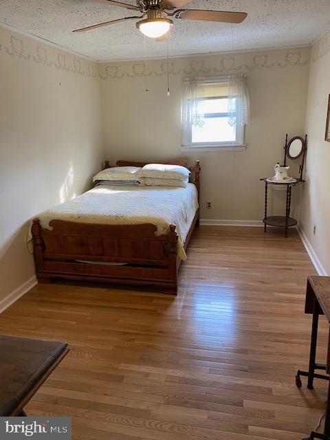 1497 Hilltop Road Pottstown, PA 19464 - Photo 13 of 25 a bedroom with a bed and a table