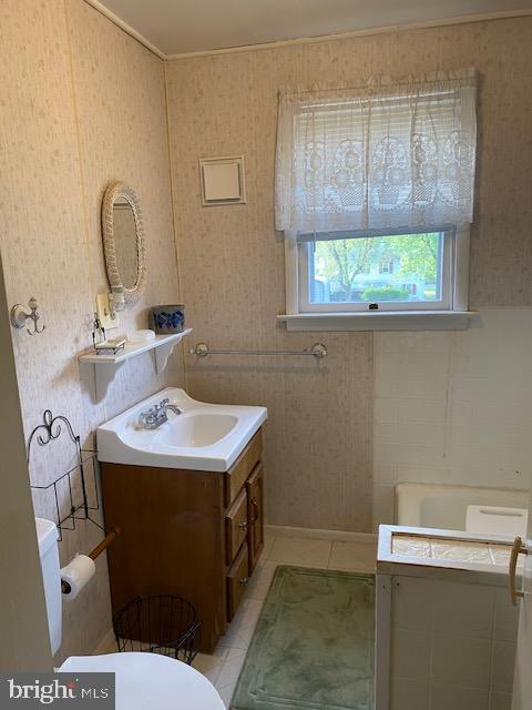1497 Hilltop Road Pottstown, PA 19464 - Photo 15 of 25 a bathroom with a sink toilet and a window