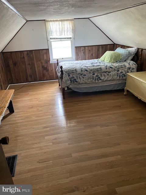 1497 Hilltop Road Pottstown, PA 19464 - Photo 17 of 25 a bedroom with a bed and a window