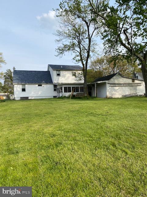 1497 Hilltop Road Pottstown, PA 19464 - Photo 21 of 25 a view of a house with a big yard and large trees