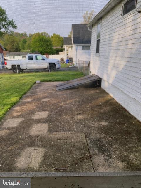 1497 Hilltop Road Pottstown, PA 19464 - Photo 23 of 25 a view of a backyard with plants and patio