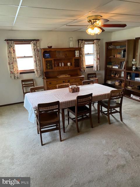 1497 Hilltop Road Pottstown, PA 19464 - Photo 6 of 25 a dining room with a furniture a chandelier a large window and a kitchen view