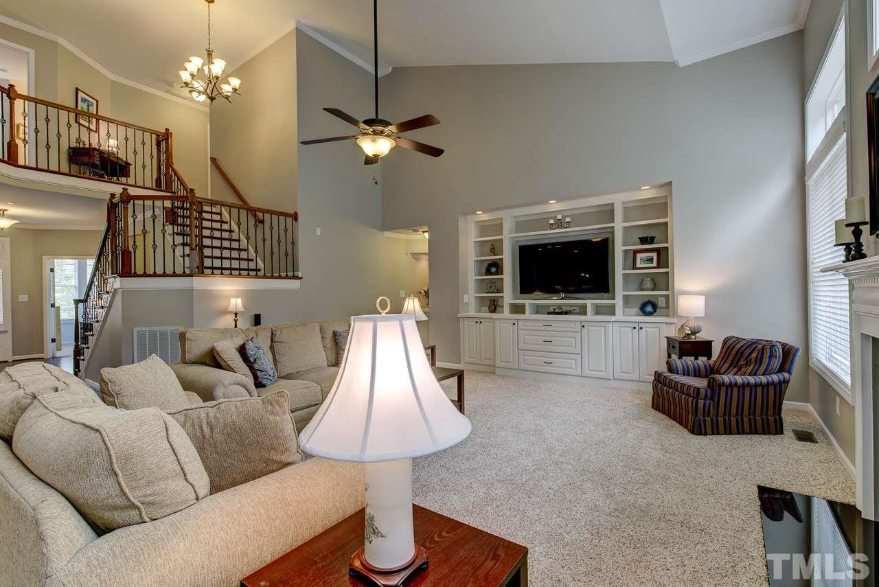 4001 Red Grape Drive Raleigh, NC 27607 - Photo 12 of 25 a living room with furniture and a flat screen tv
