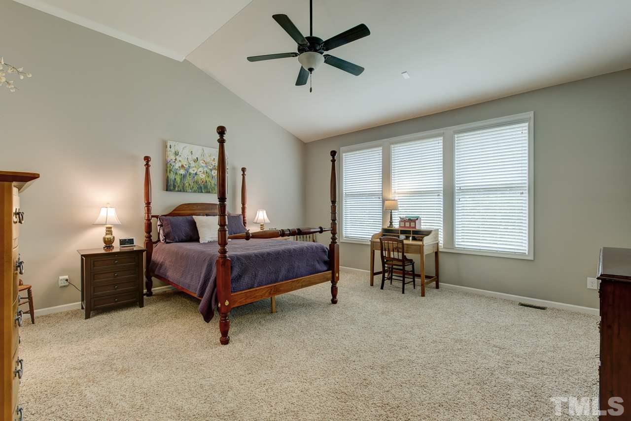 4001 Red Grape Drive Raleigh, NC 27607 - Photo 14 of 25 a bedroom with furniture and a window