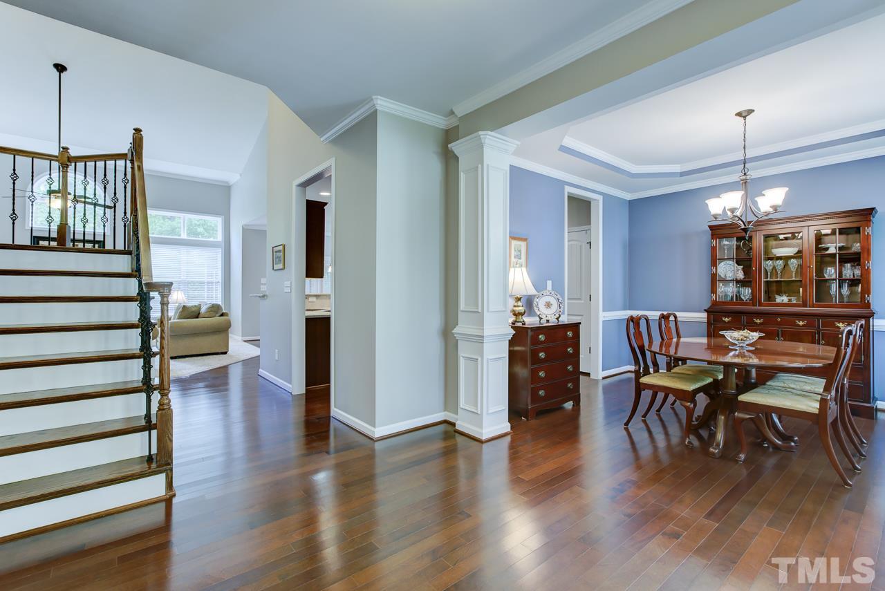 4001 Red Grape Drive Raleigh, NC 27607 - Photo 5 of 25 a view of a dining room with furniture and wooden floor