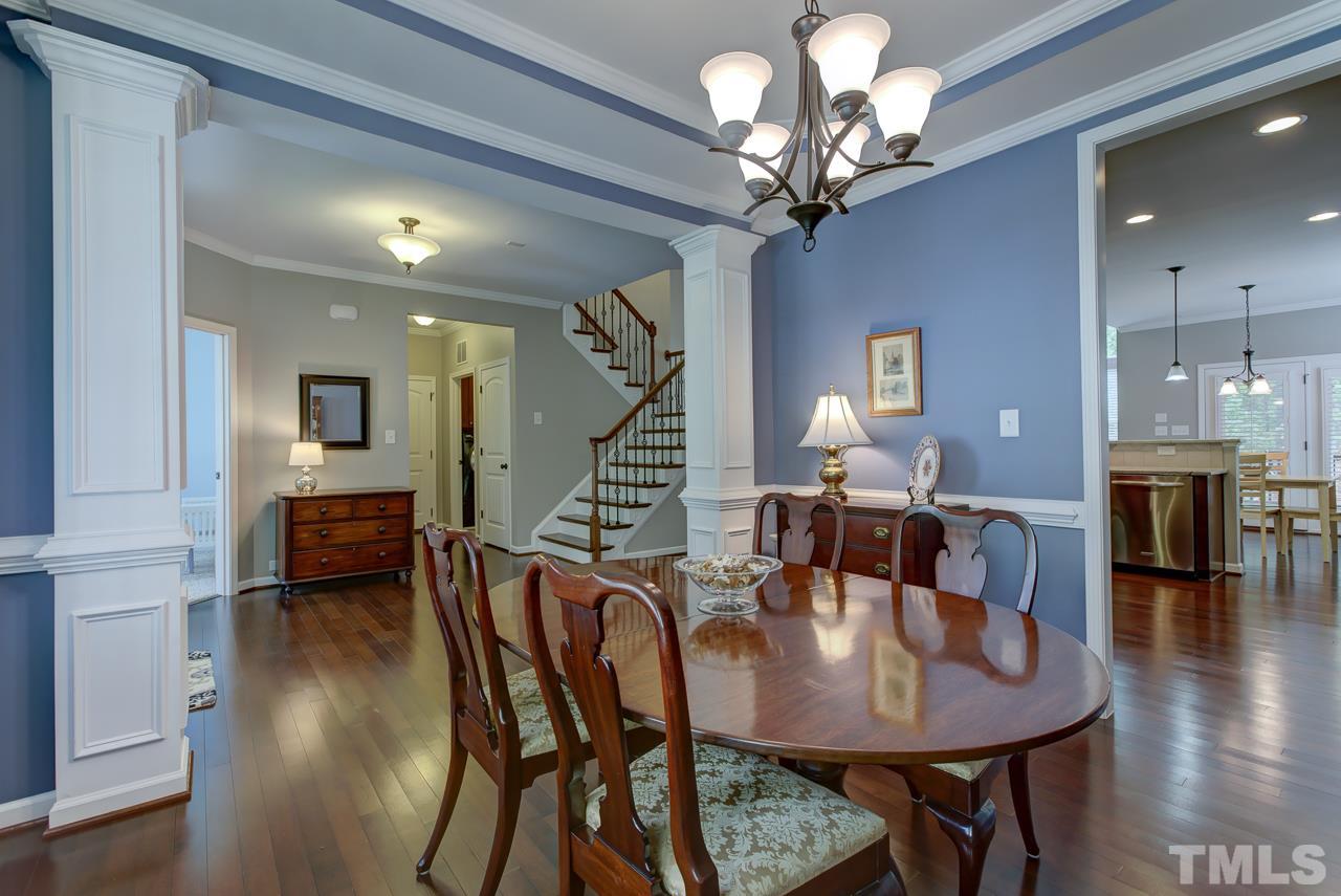 4001 Red Grape Drive Raleigh, NC 27607 - Photo 6 of 25 a view of a dining room with furniture and wooden floor