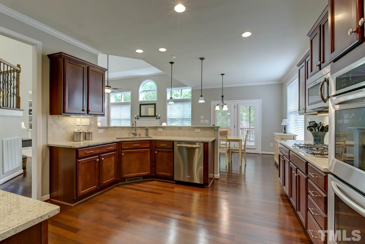 4001 Red Grape Drive Raleigh, NC 27607 - Photo 9 of 25 a large kitchen with stainless steel appliances lots of counter top space