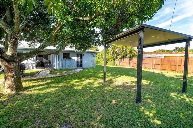 a view of a house with a yard porch and sitting area