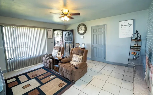 a living room with furniture and a window