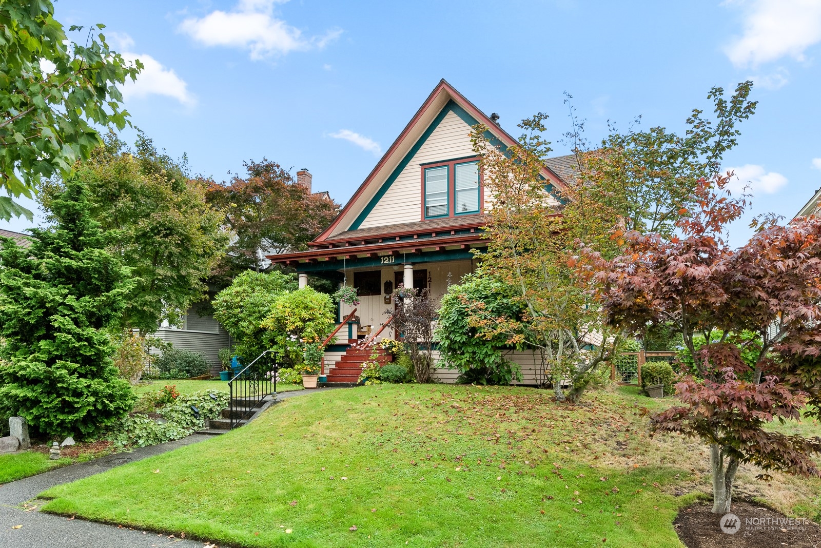1211 Rucker Avenue Everett, WA 98201 - Photo 1 of 40 a view of a house with a yard and potted plants