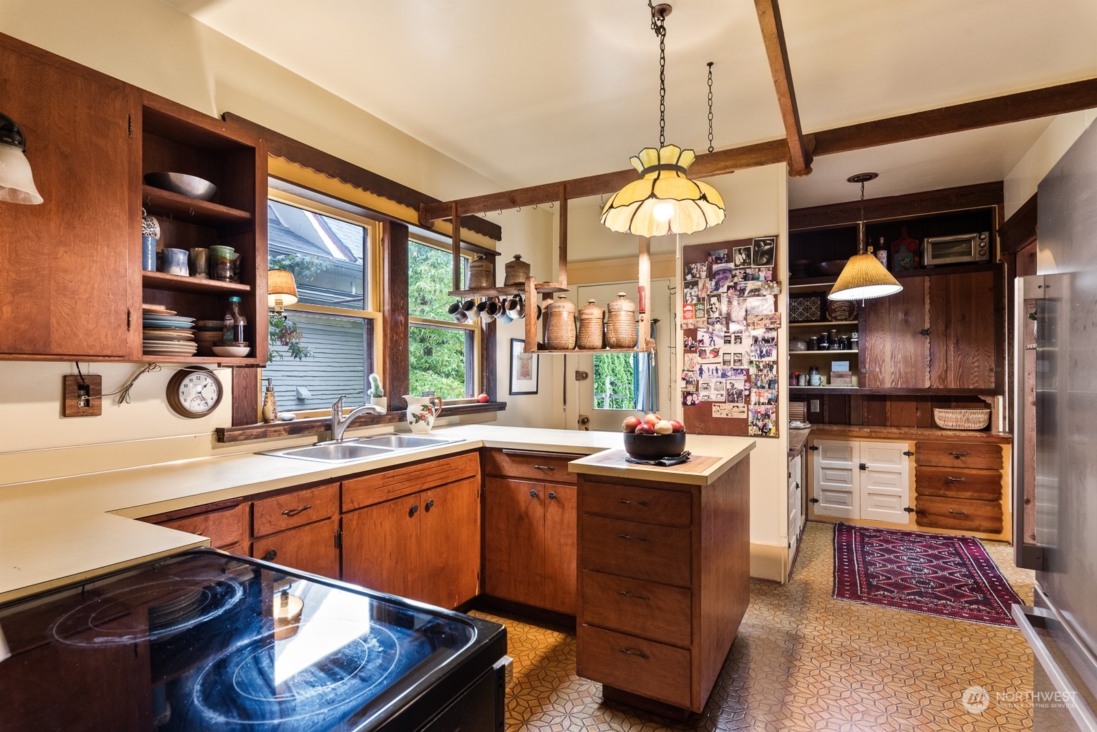1211 Rucker Avenue Everett, WA 98201 - Photo 17 of 40 a kitchen with a sink and cabinets