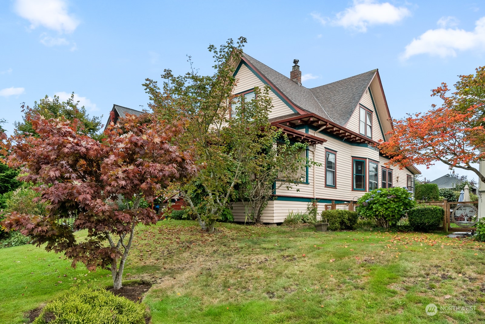 1211 Rucker Avenue Everett, WA 98201 - Photo 2 of 40 a house that has a tree in front of it