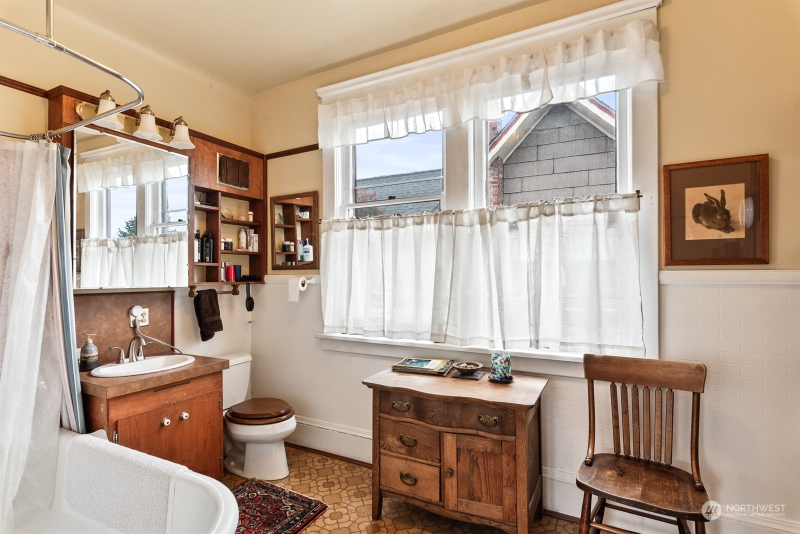 1211 Rucker Avenue Everett, WA 98201 - Photo 27 of 40 a room with a toilet a sink and a window