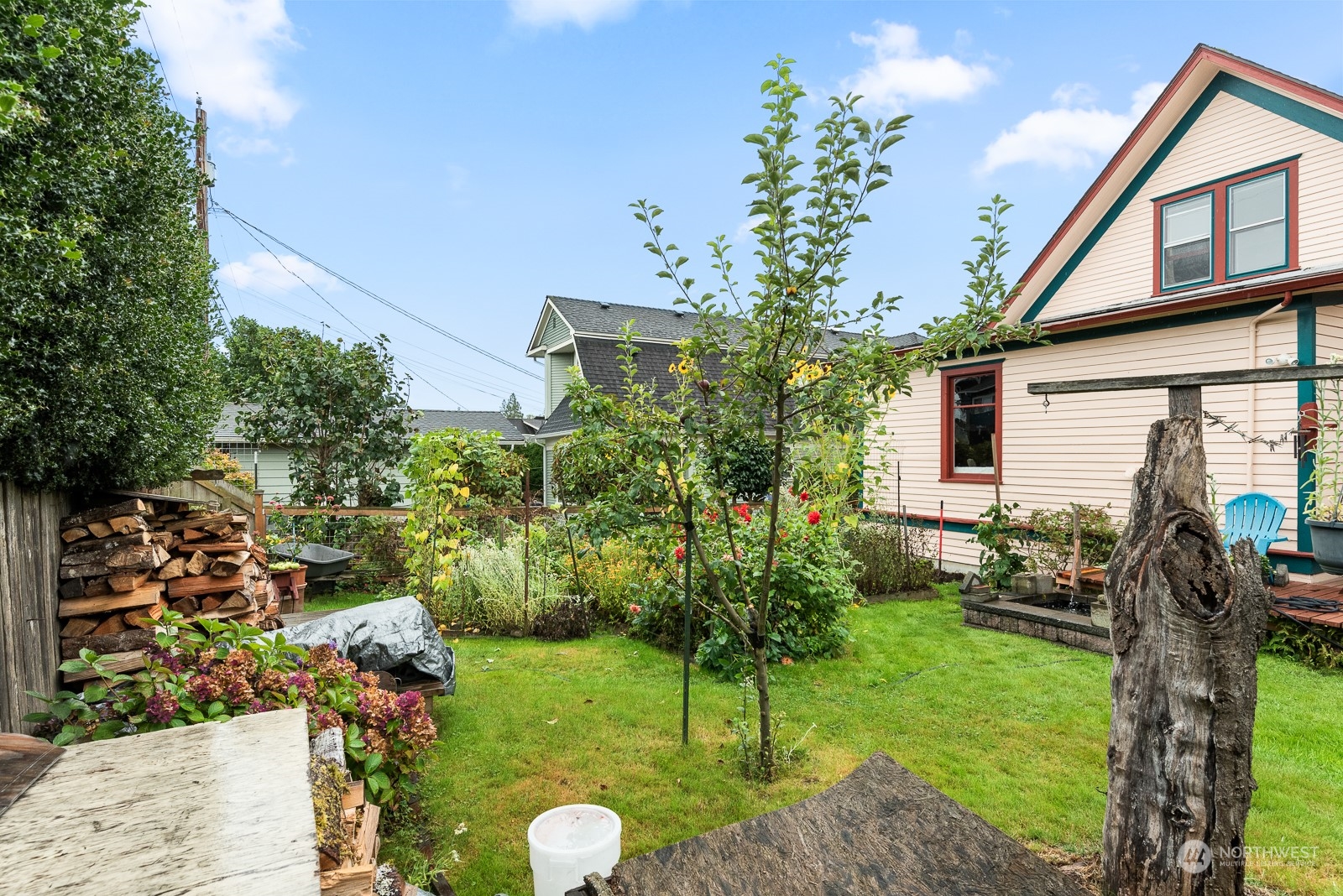 1211 Rucker Avenue Everett, WA 98201 - Photo 35 of 40 a view of a house with a backyard and a tree