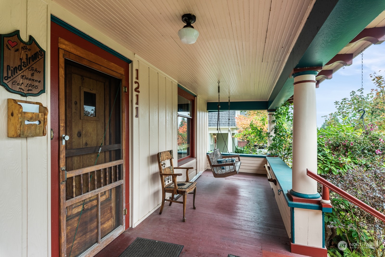 1211 Rucker Avenue Everett, WA 98201 - Photo 5 of 40 a view of a porch with chairs and potted plants
